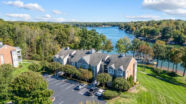 an aerial view of a house with garden space and outdoor seating
