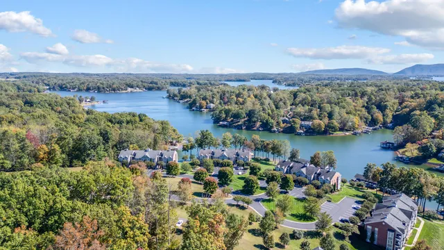 a living room with furniture fireplace and a large window