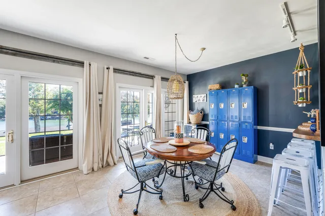 a kitchen with sink and refrigerator