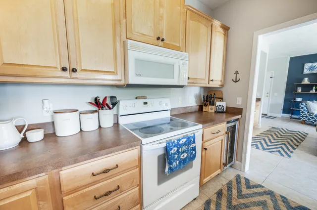 a spacious bathroom with a granite countertop sink mirror and shower