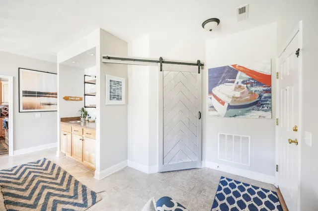 a view of a dining room with furniture and window