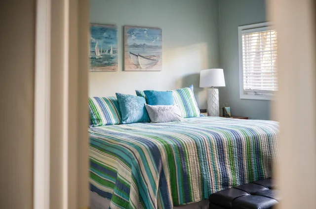 a view of a house with backyard porch and sitting area