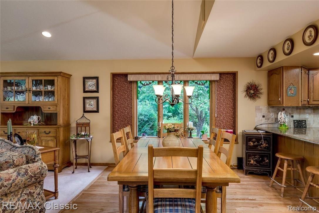 3056 Rivers Edge Drive North Wayne, MI 48184 - Photo 10 of 27 The dining room off the living room wonderful window ... what a view... hardwood flooring.