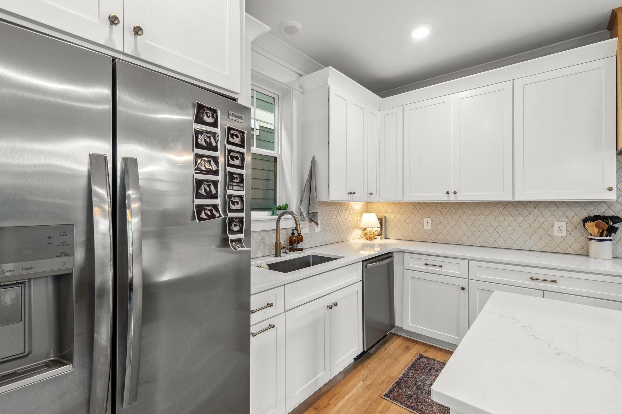 423 A American Road Nashville, TN 37209 - Photo 12 of 47 a kitchen with a sink stainless steel appliances and cabinets