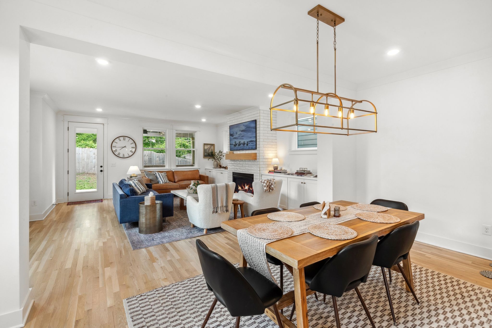 423 A American Road Nashville, TN 37209 - Photo 15 of 47 a dining room with furniture a chandelier and wooden floor