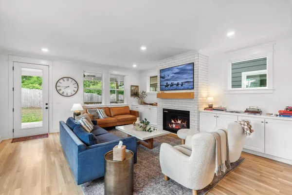 a living room with furniture and a fireplace
