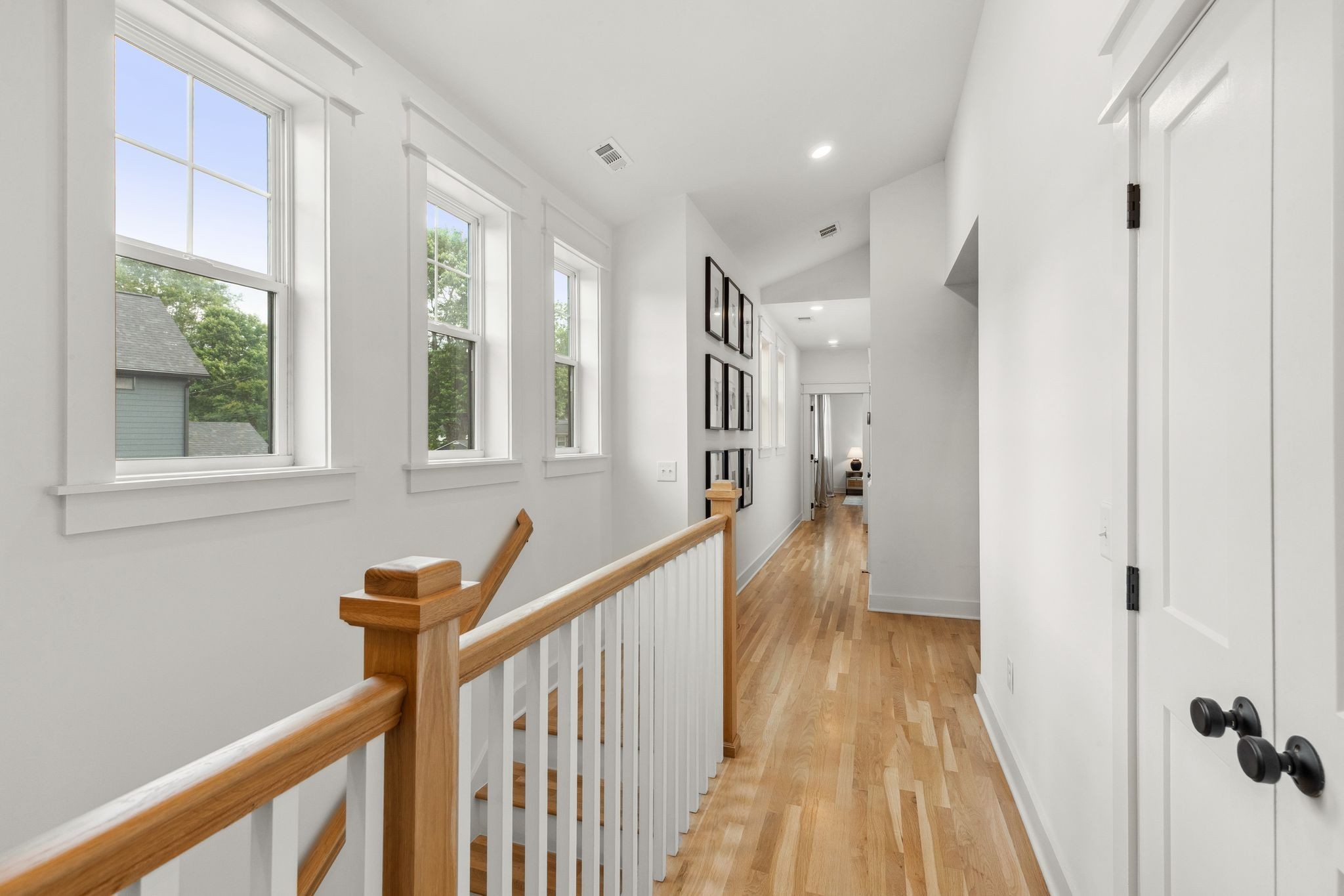 423 A American Road Nashville, TN 37209 - Photo 20 of 47 a view of a hallway with wooden floor and staircase