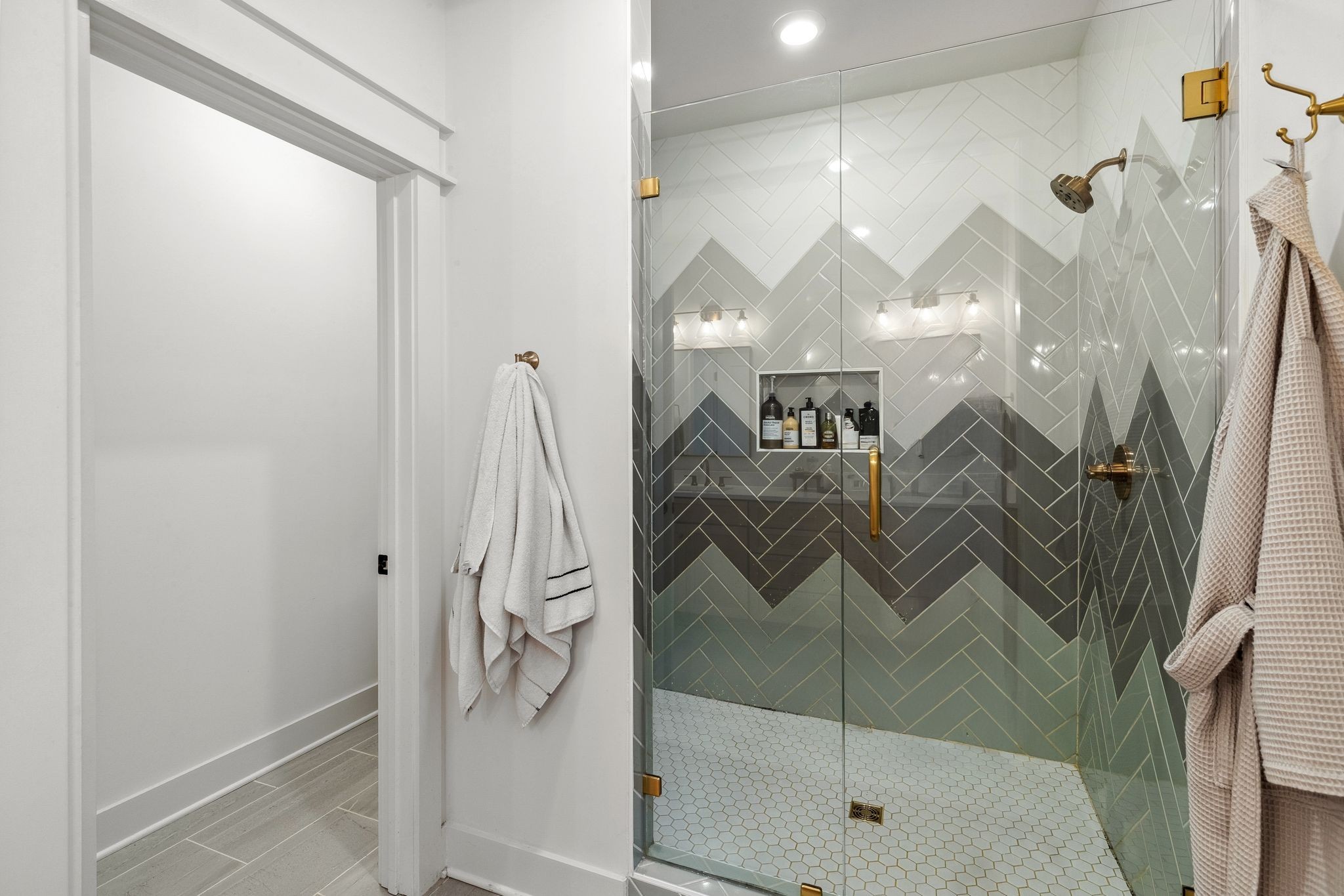 423 A American Road Nashville, TN 37209 - Photo 28 of 47 a bathroom with a glass shower door and a sink