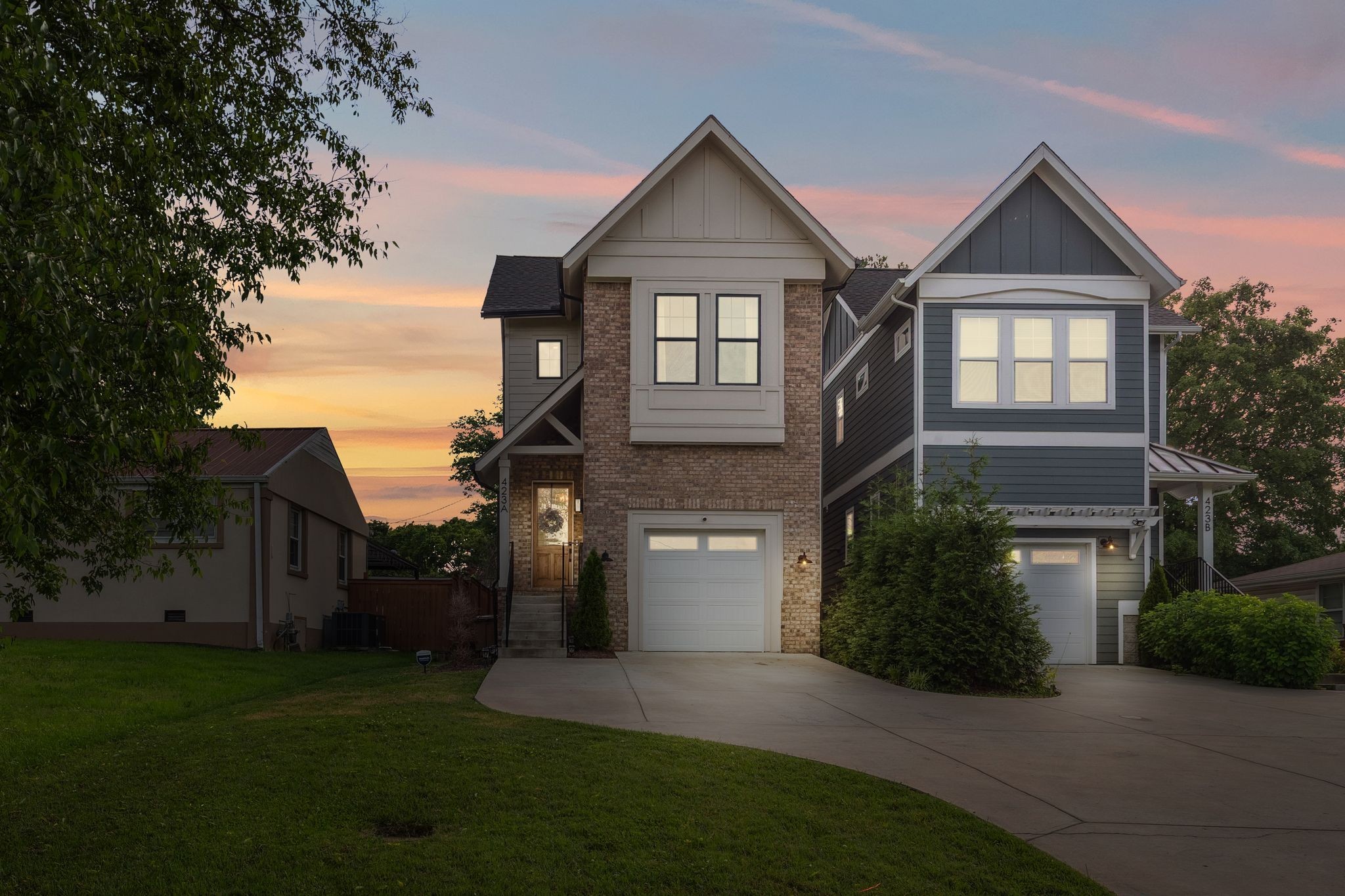 423 A American Road Nashville, TN 37209 - Photo 3 of 47 a front view of a house with a yard and garage
