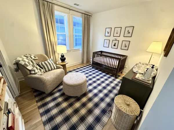 a bedroom with furniture and a window