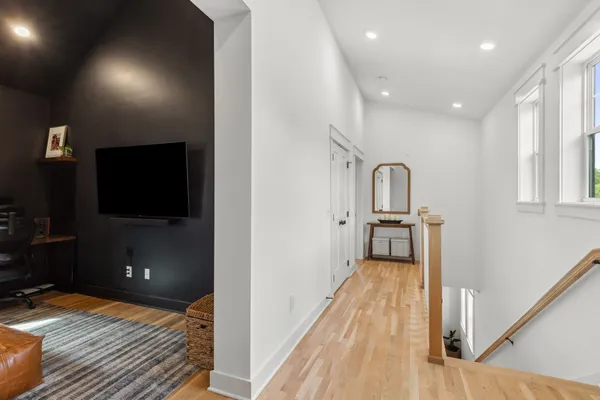 a view of a living room with a flat screen tv