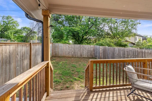 a view of a patio with table and chairs with wooden floor