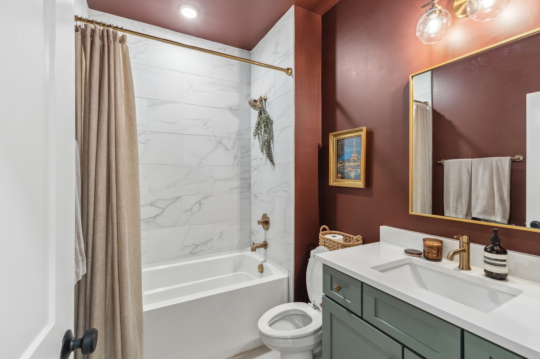 423 A American Road Nashville, TN 37209 - Photo 8 of 47 a bathroom with a sink a toilet a mirror a vanity and bathtub