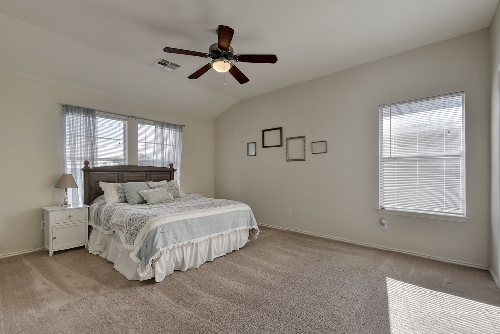2201 Keepsake Drive Austin, TX 78745 - Photo 11 of 25 a bedroom with a bed and window