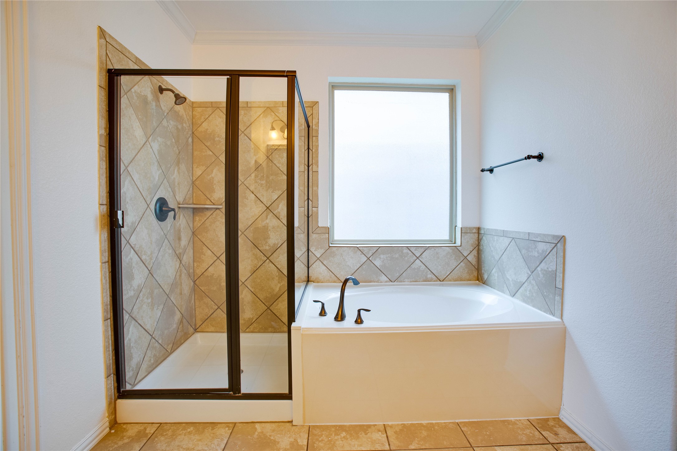 6210 Pinewood Heights Drive Spring, TX 77389 - Photo 16 of 24 a bathroom with a tub and shower