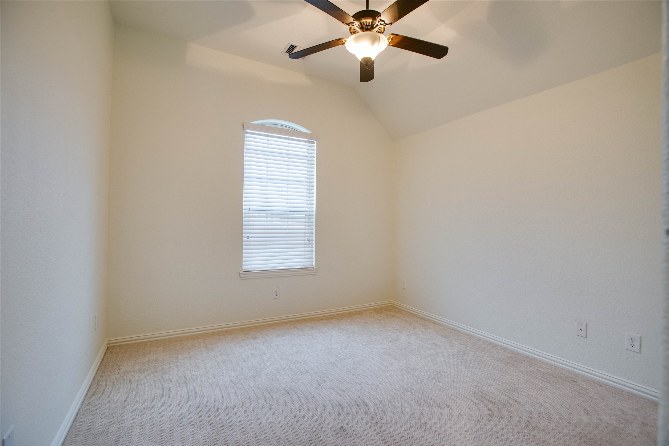 6210 Pinewood Heights Drive Spring, TX 77389 - Photo 18 of 24 an empty room with a window and a fan