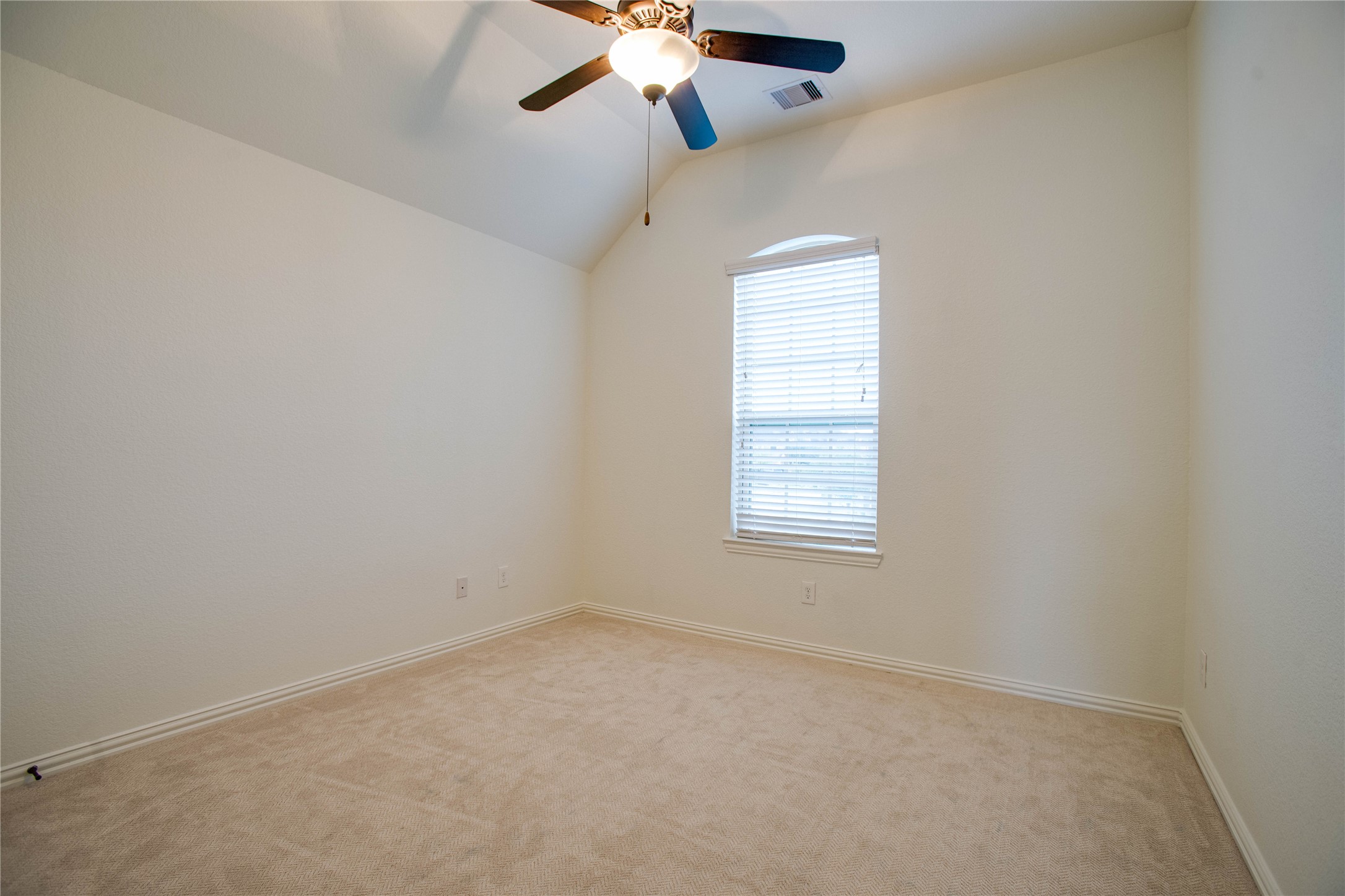 6210 Pinewood Heights Drive Spring, TX 77389 - Photo 19 of 24 an empty room with a window and a fan