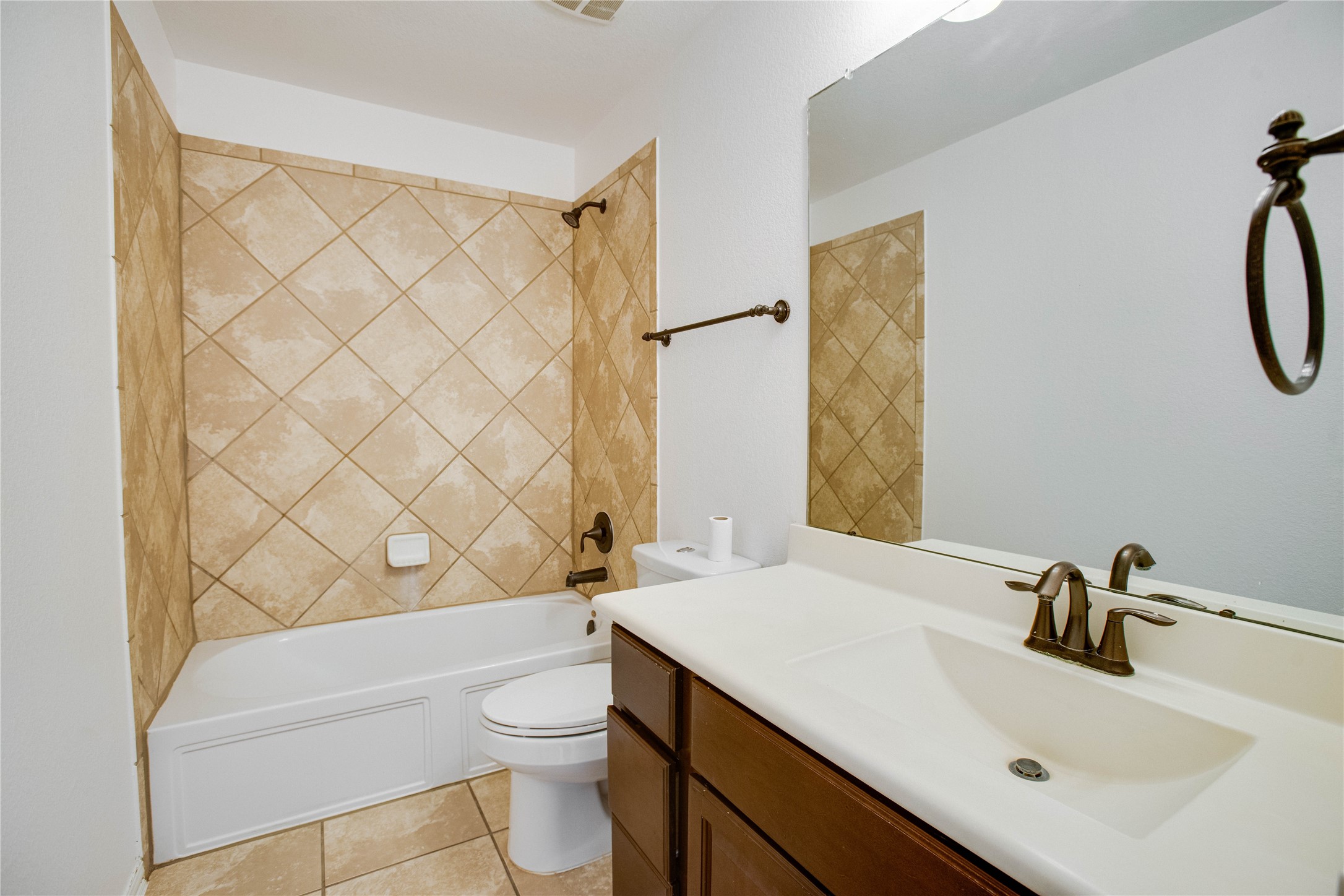 6210 Pinewood Heights Drive Spring, TX 77389 - Photo 20 of 24 a bathroom with a sink a toilet and shower curtain