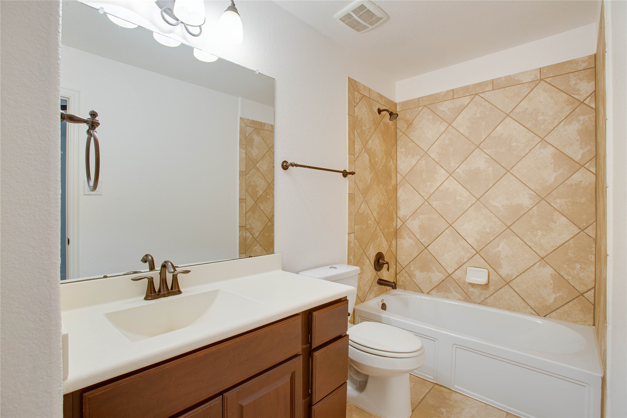 6210 Pinewood Heights Drive Spring, TX 77389 - Photo 22 of 24 a bathroom with a sink a toilet and shower