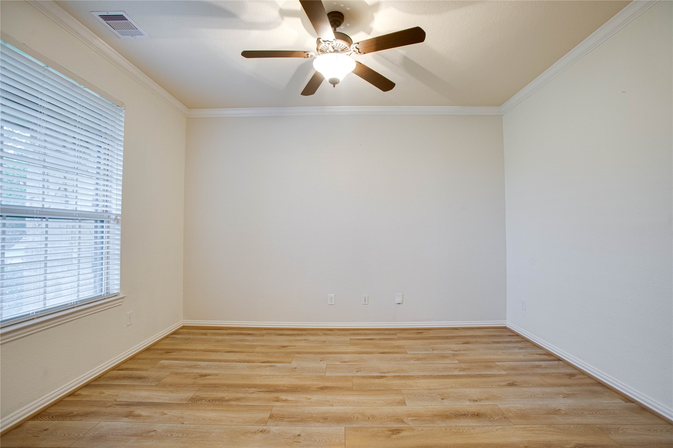 6210 Pinewood Heights Drive Spring, TX 77389 - Photo 4 of 24 wooden floor in an empty room with a window