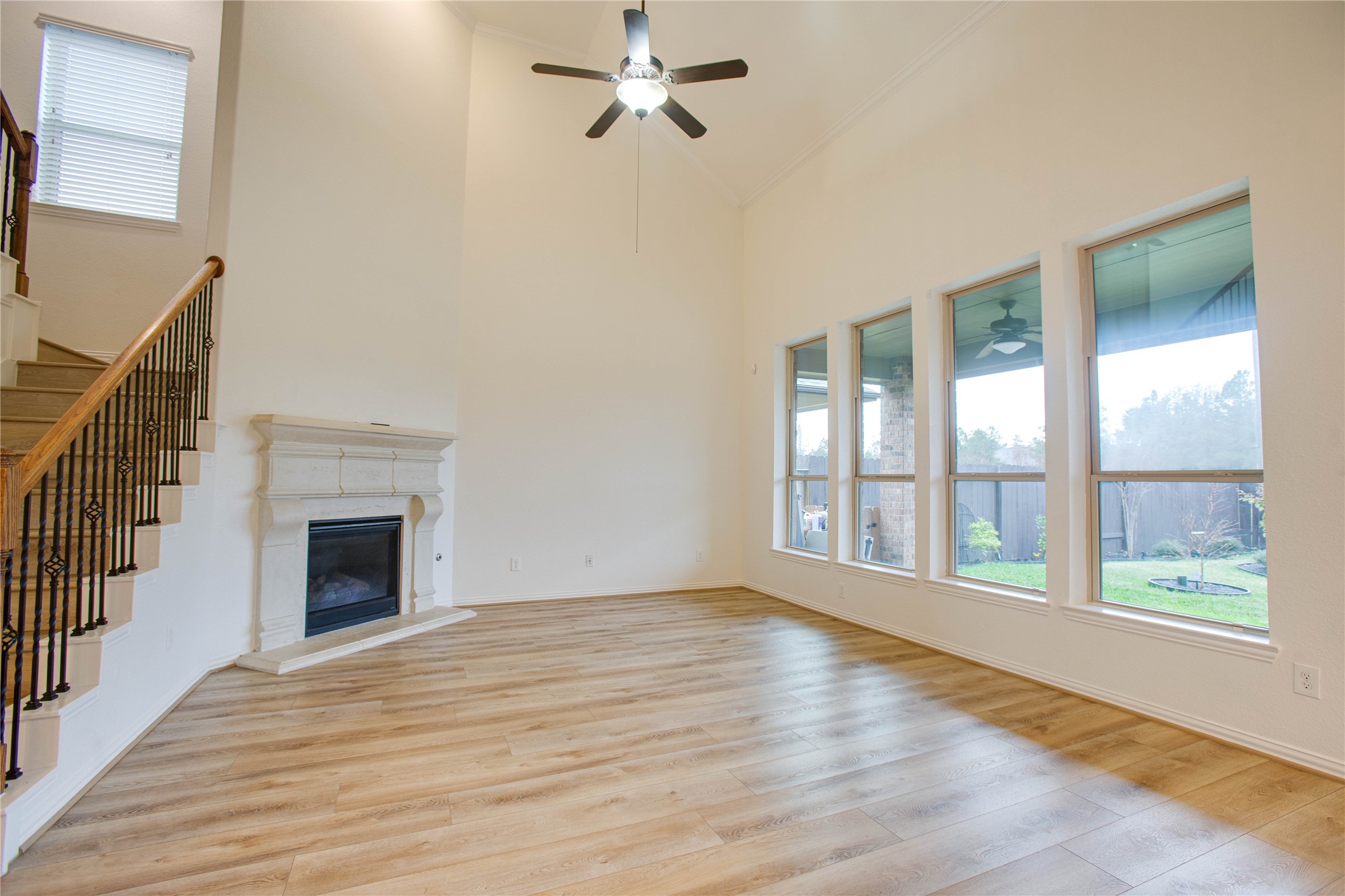 6210 Pinewood Heights Drive Spring, TX 77389 - Photo 5 of 24 a view of an empty room with wooden floor and a window