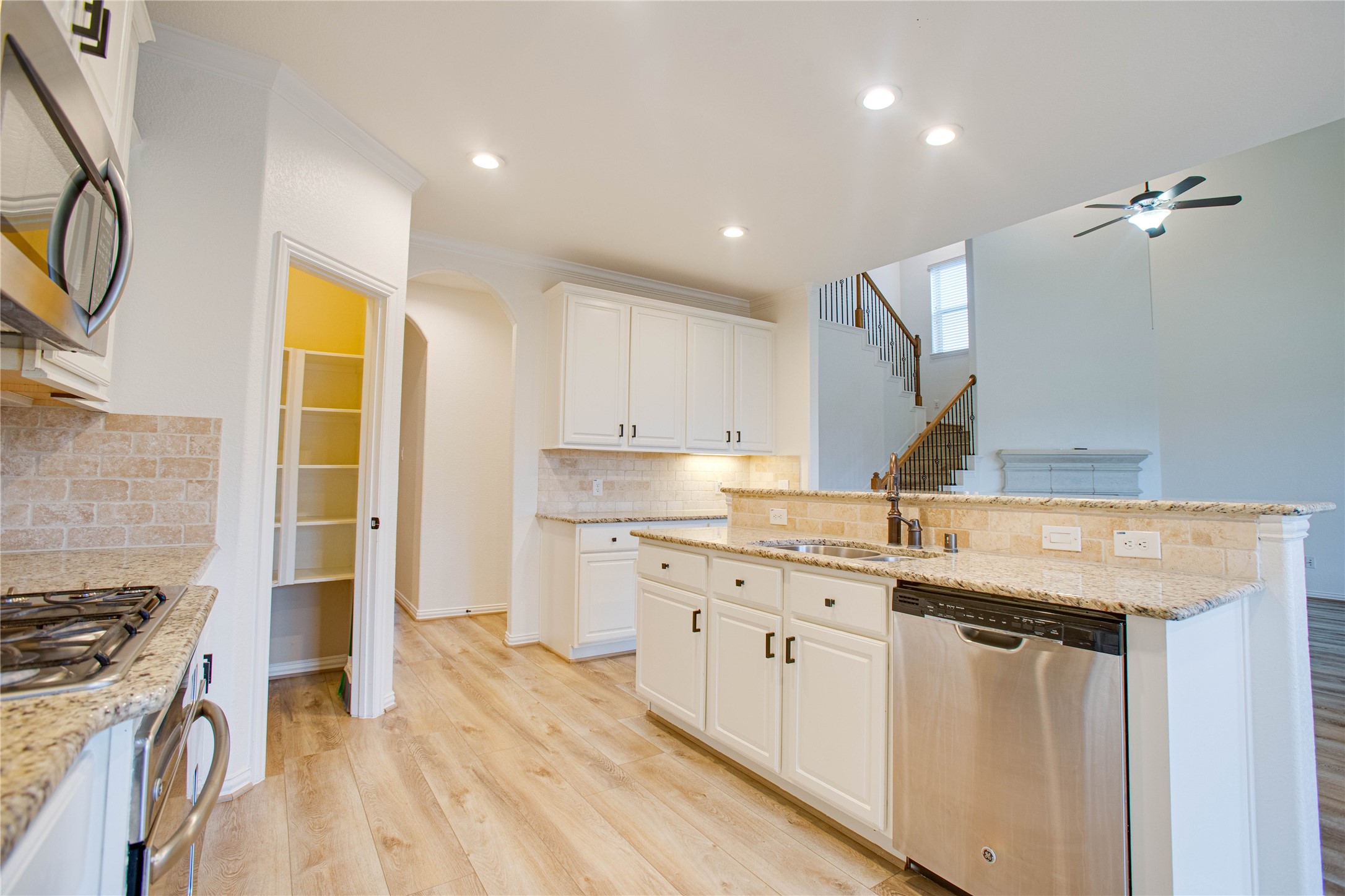 6210 Pinewood Heights Drive Spring, TX 77389 - Photo 8 of 24 a kitchen with a sink stove and cabinets