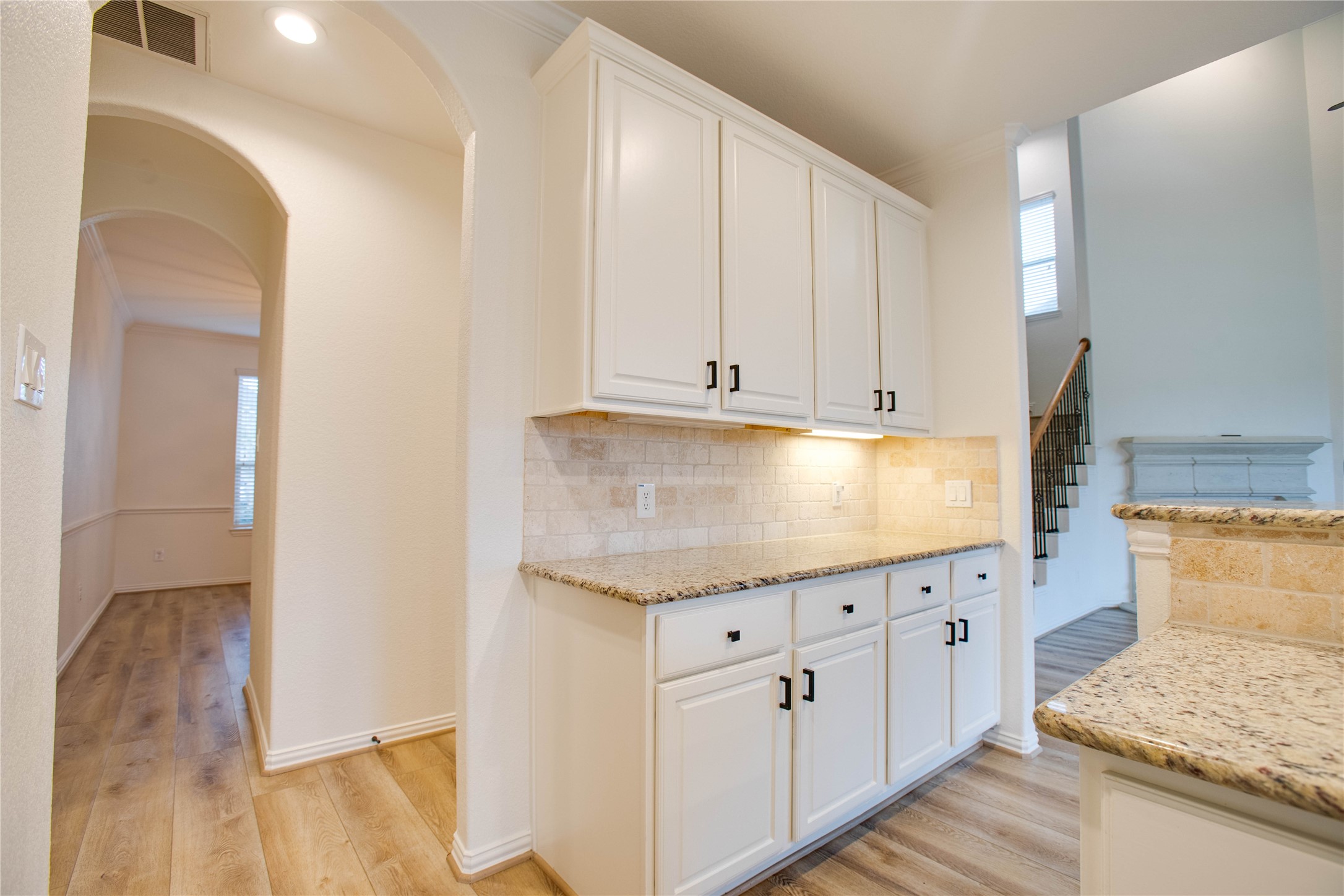 6210 Pinewood Heights Drive Spring, TX 77389 - Photo 9 of 24 a kitchen with granite countertop white cabinets and sink