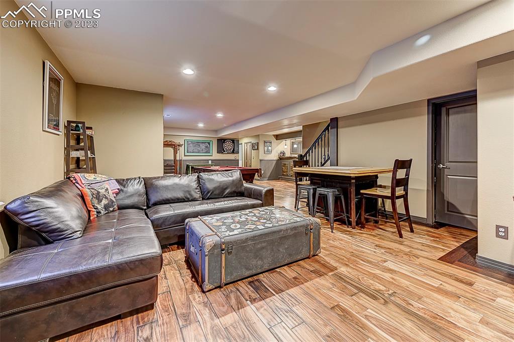 7555 Antelope Meadows Circle Peyton, CO 80831 - Photo 4 of 7 a living room with furniture and a wooden floor