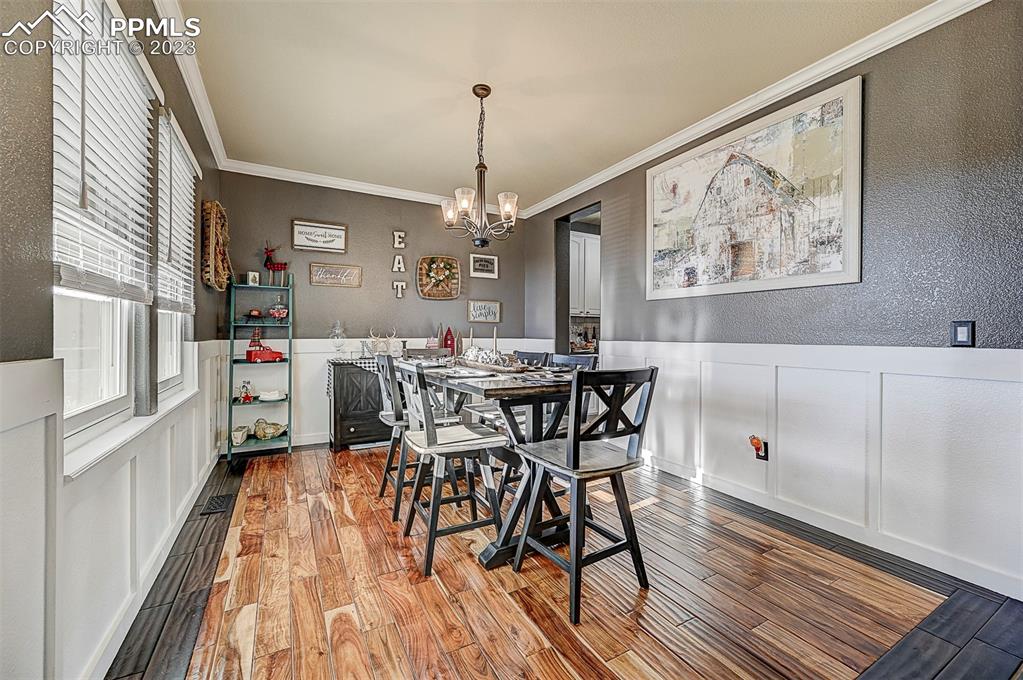 7555 Antelope Meadows Circle Peyton, CO 80831 - Photo 7 of 7 a view of a dining room with furniture window and wooden floor