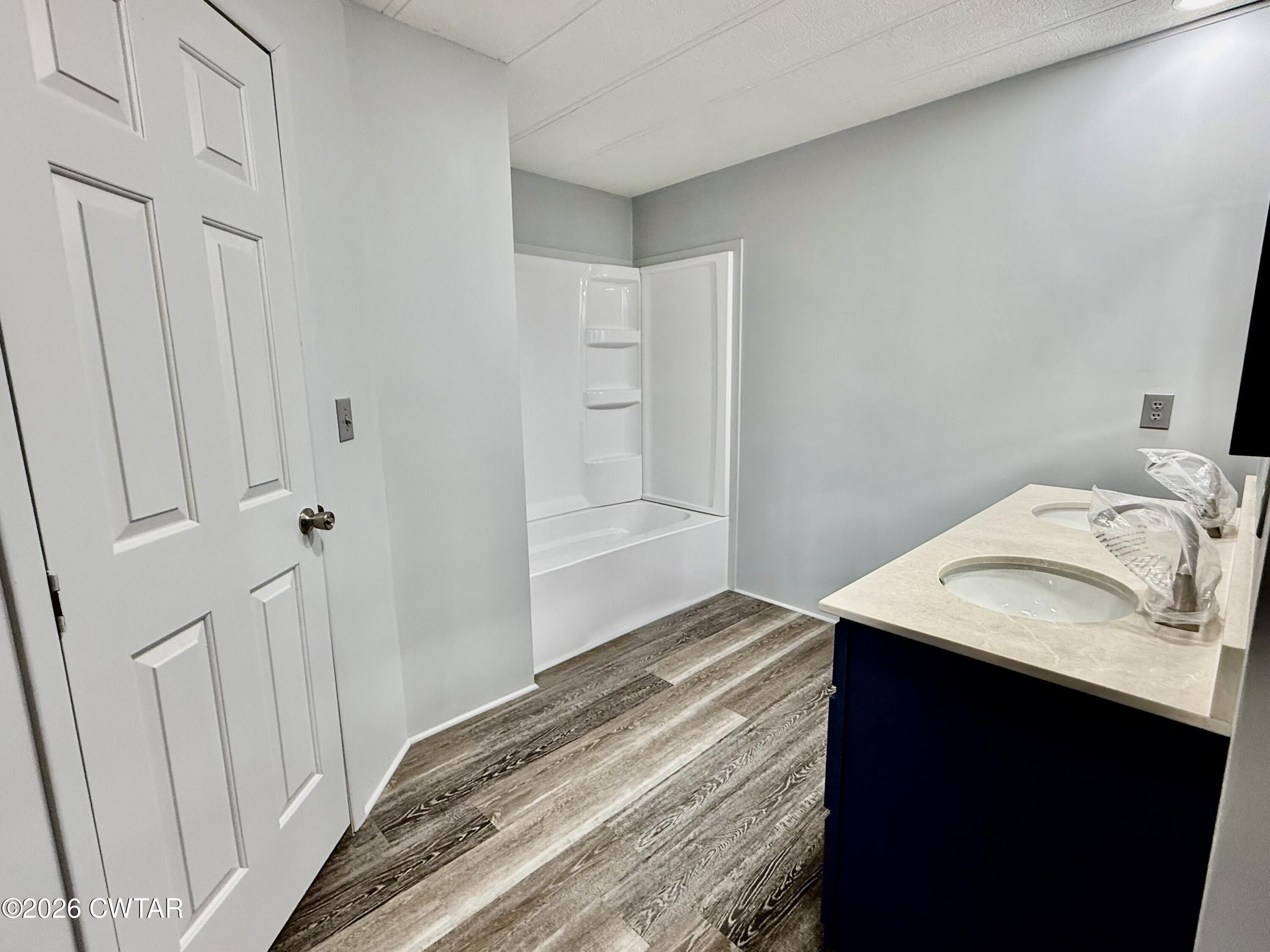 0 Antioch Church Road Hornbeak, TN 38232 - Photo 14 of 18 a bedroom with a sink and a mirror