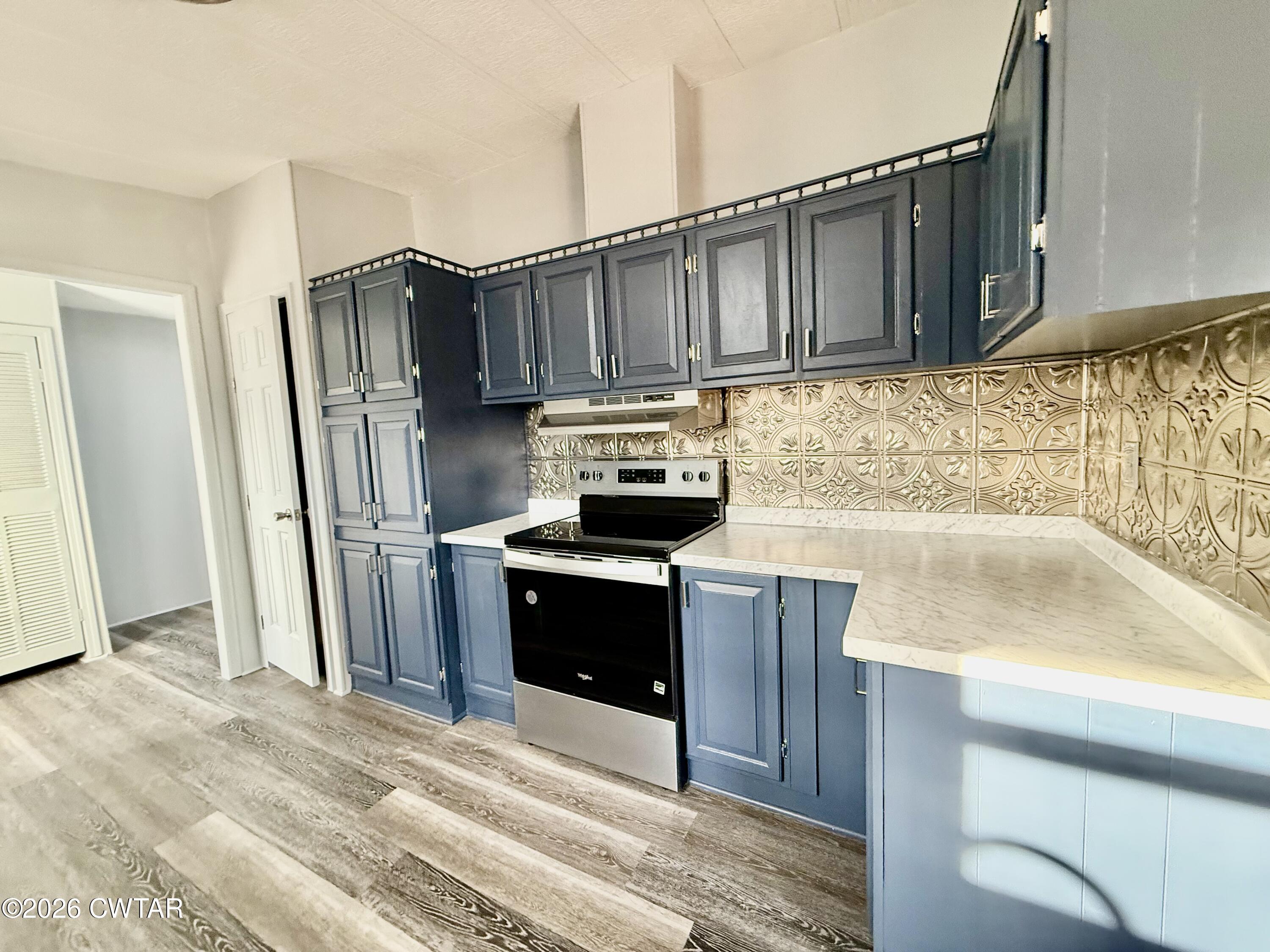 0 Antioch Church Road Hornbeak, TN 38232 - Photo 6 of 18 a kitchen with granite countertop a refrigerator and a sink