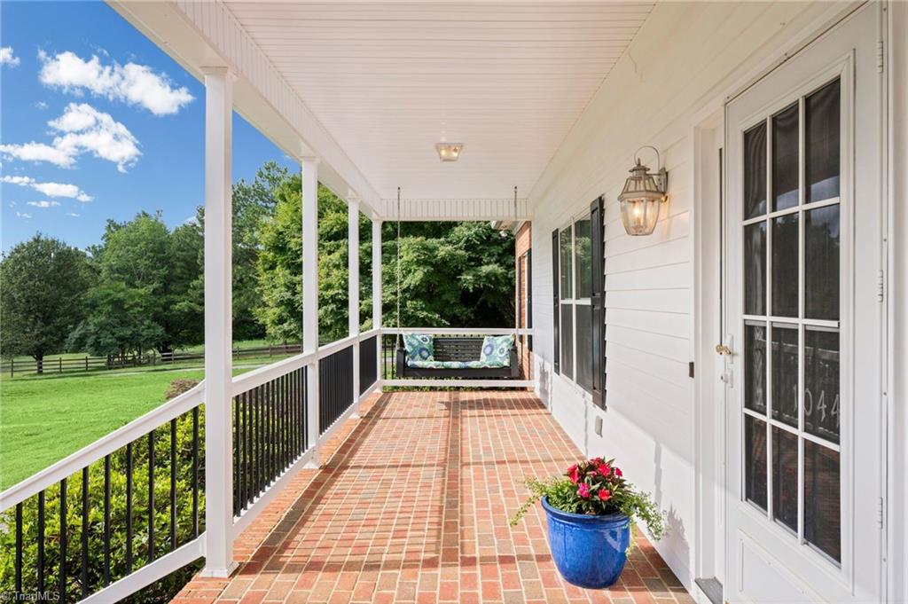 1044 Lasley Road Lewisville, NC 27023 - Photo 5 of 50 A front porch that calls for quiet mornings and evenings