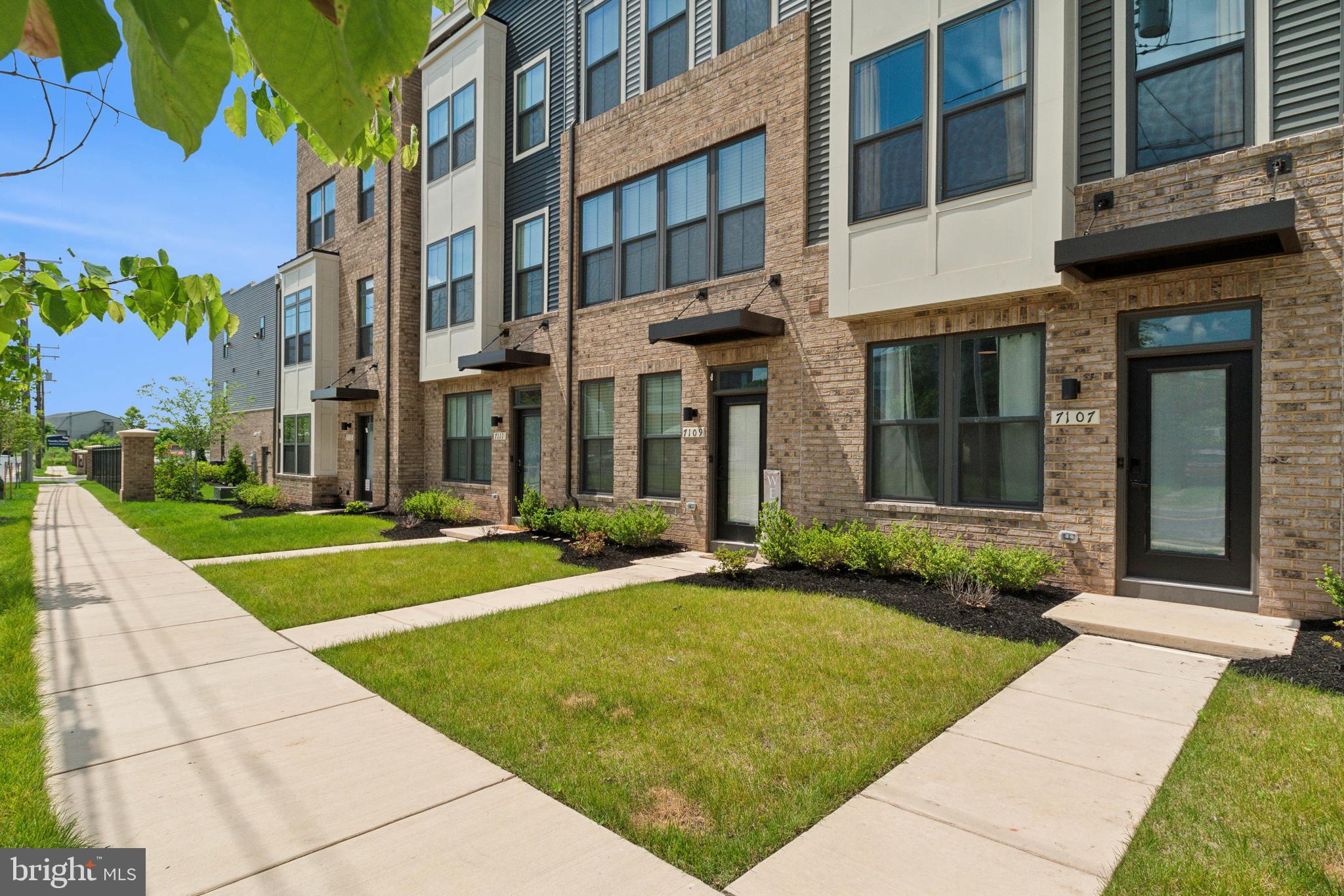 a view of a building with a yard