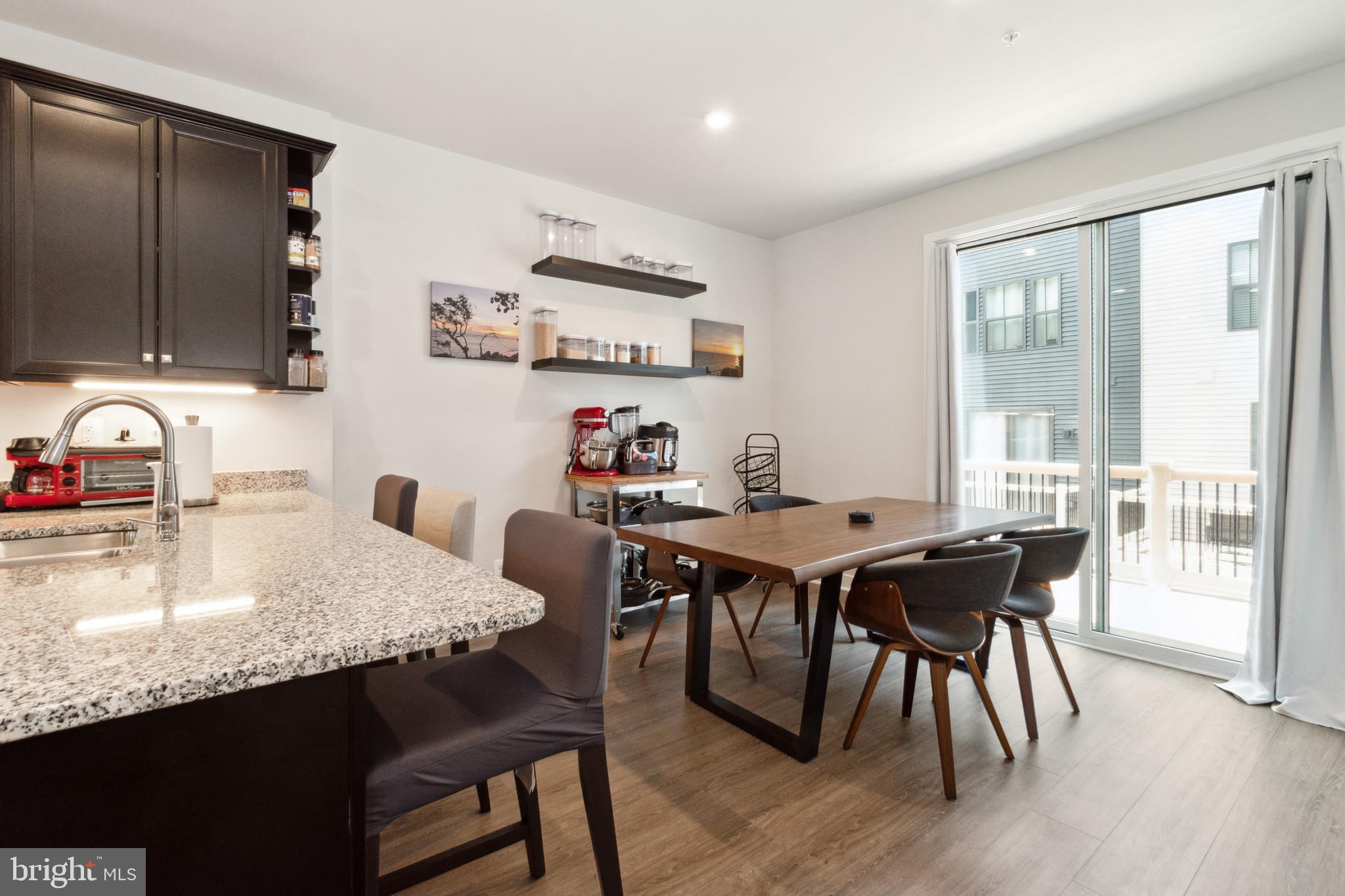 7107 Sollers Point Road Dundalk, MD 21222 - Photo 12 of 25 a dining room with furniture and wooden floor