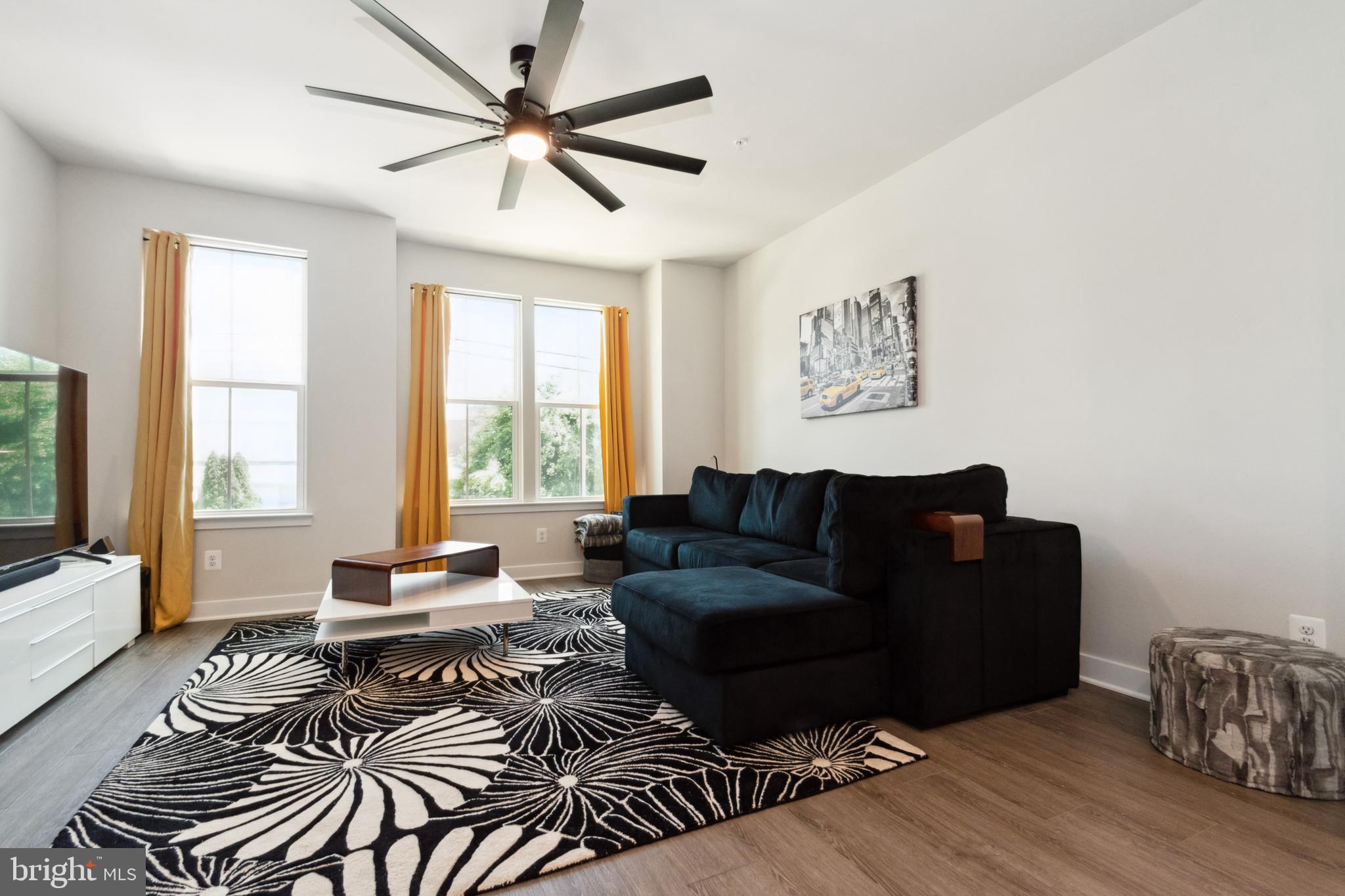 7107 Sollers Point Road Dundalk, MD 21222 - Photo 13 of 25 a living room with furniture and wooden floor