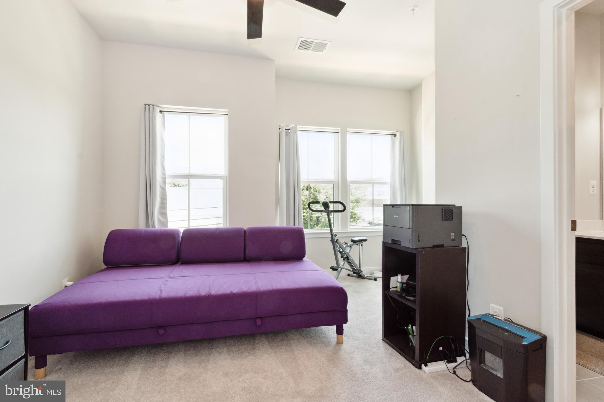 7107 Sollers Point Road Dundalk, MD 21222 - Photo 23 of 25 a bedroom with a bed and a couch