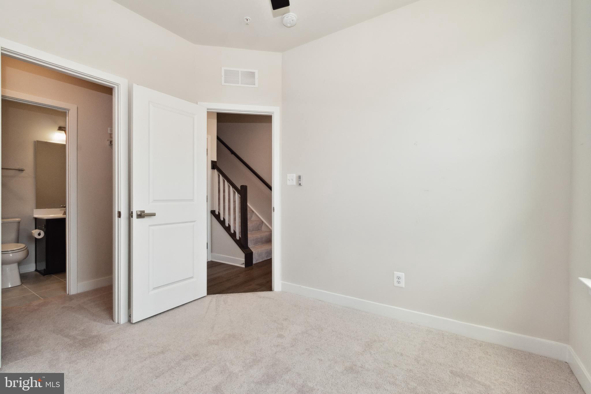 7107 Sollers Point Road Dundalk, MD 21222 - Photo 4 of 25 an entryway in a hall with a window