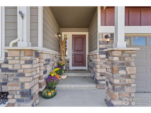 a view of an entryway with a wooden door