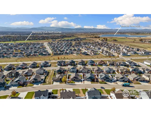 an aerial view of residential building and ocean