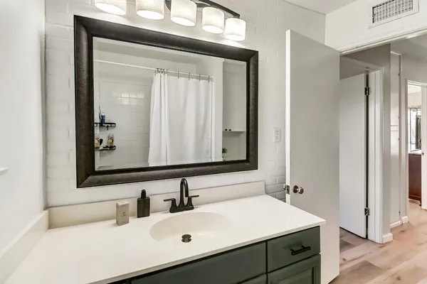 a bathroom with a sink and a mirror