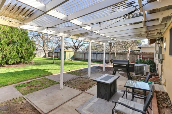 a view of a swimming pool with a yard