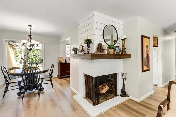 a view of a livingroom with furniture and a fireplace