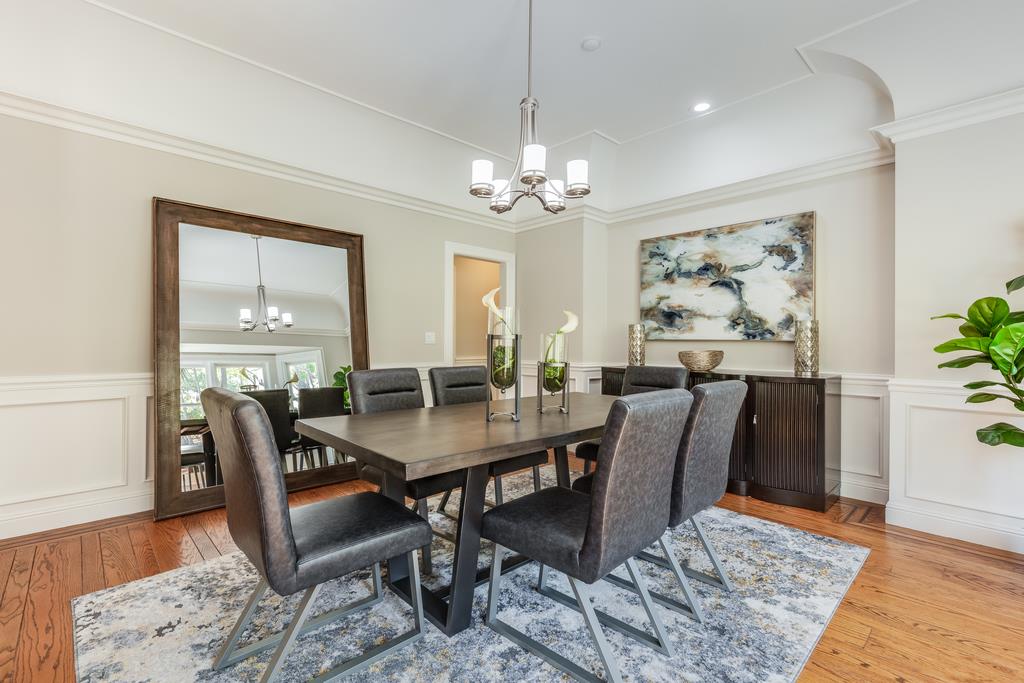 12385 Parker Ranch Road Saratoga, CA 95070 - Photo 14 of 50 a view of a dining room with furniture window and wooden floor