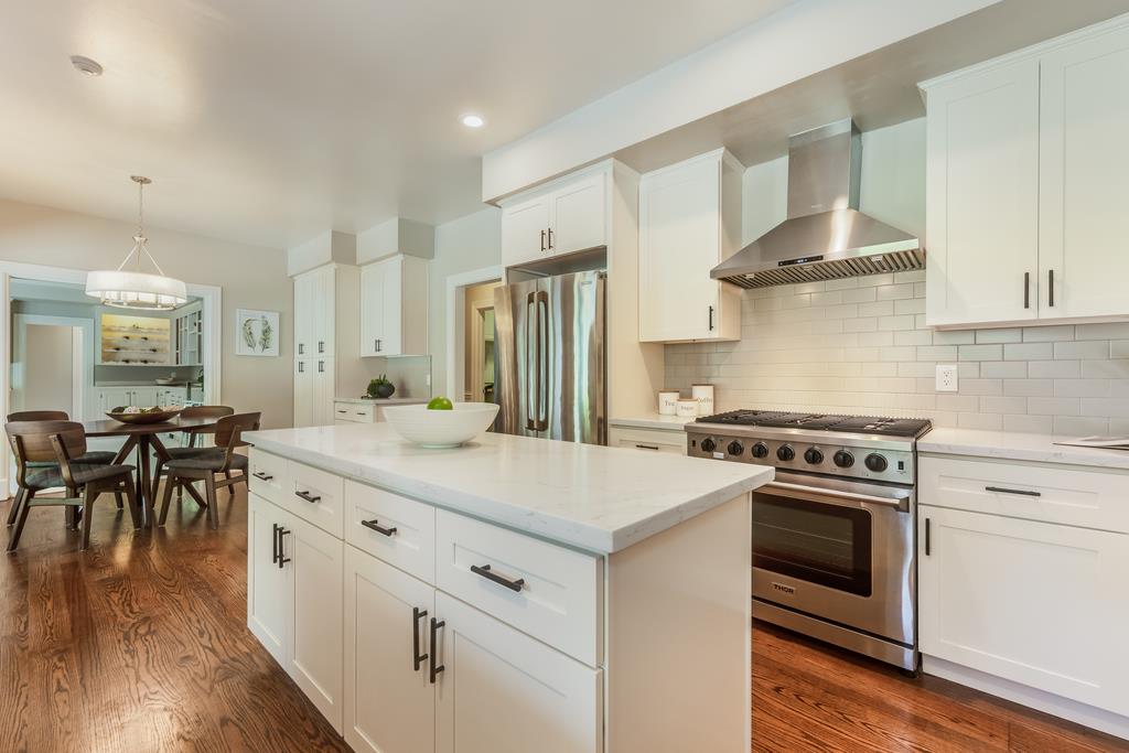 12385 Parker Ranch Road Saratoga, CA 95070 - Photo 18 of 50 a kitchen with a stove a sink and a refrigerator