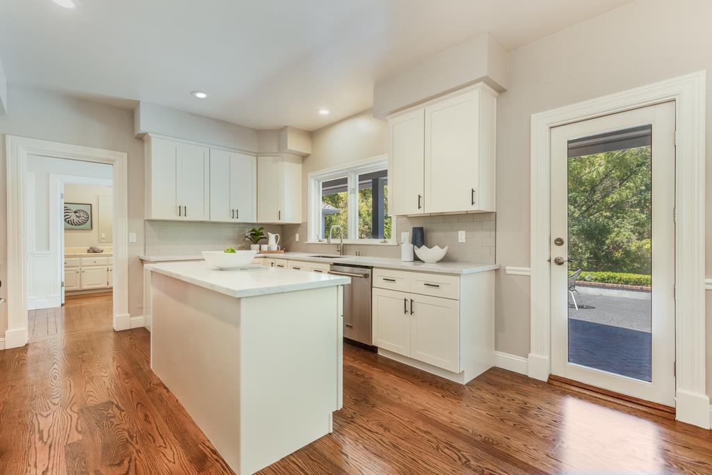 12385 Parker Ranch Road Saratoga, CA 95070 - Photo 20 of 50 a kitchen with white cabinets stove and sink