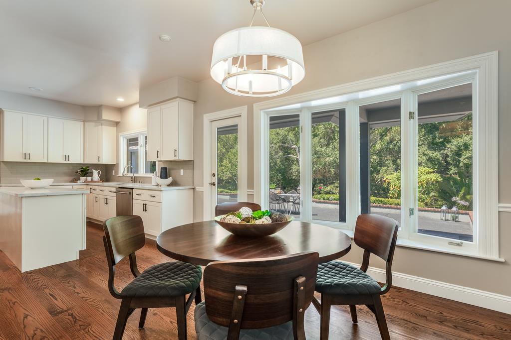 12385 Parker Ranch Road Saratoga, CA 95070 - Photo 23 of 50 a view of a dining room with furniture wooden floor and a chandelier
