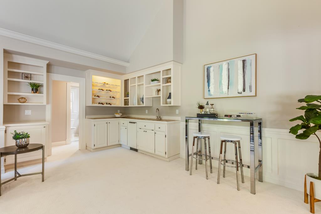 12385 Parker Ranch Road Saratoga, CA 95070 - Photo 28 of 50 a kitchen with granite countertop white cabinets and white appliances