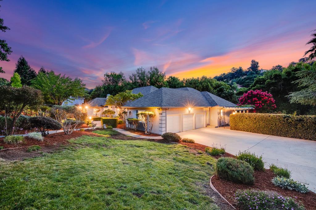 12385 Parker Ranch Road Saratoga, CA 95070 - Photo 3 of 50 a view of a house with swimming pool and a yard