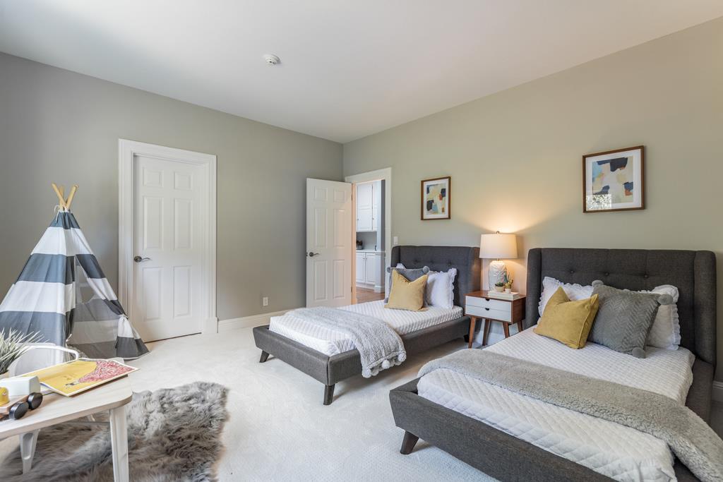 12385 Parker Ranch Road Saratoga, CA 95070 - Photo 34 of 50 a spacious bedroom with two beds and a couch