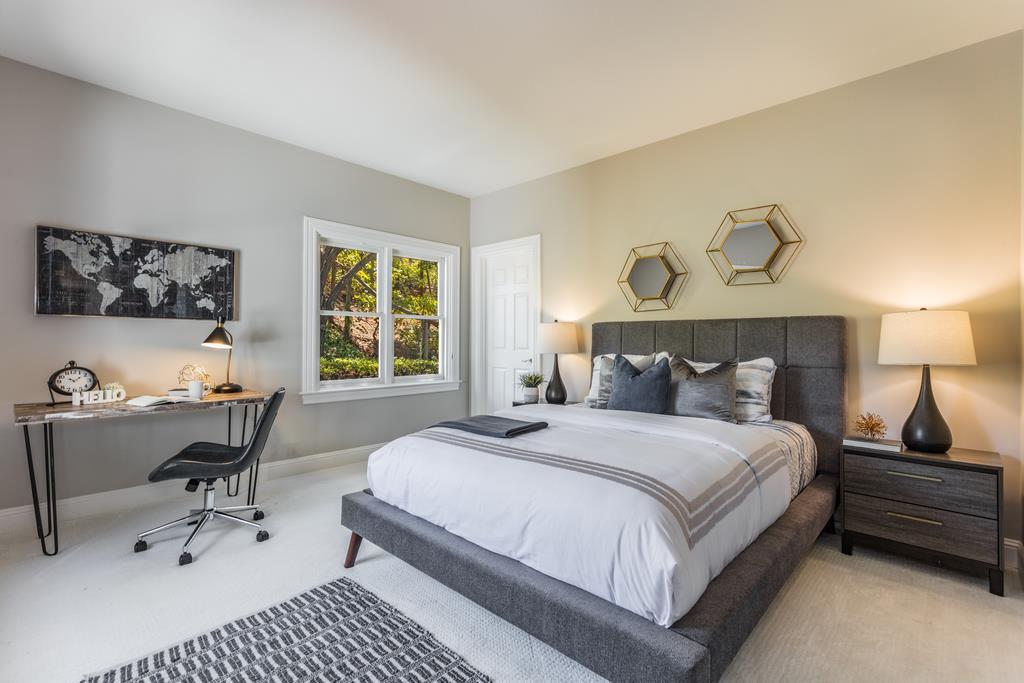 12385 Parker Ranch Road Saratoga, CA 95070 - Photo 37 of 50 a bedroom with a bed and a table in it